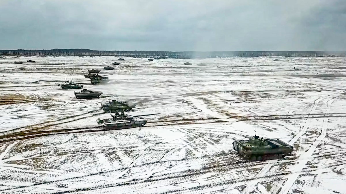 In this photo taken from video and released by the Russian Defense Ministry Press Service on Friday, Feb. 4, 2022, tanks move during the Belarusian and Russian joint military drills at Brestsky firing range, Belarus. 