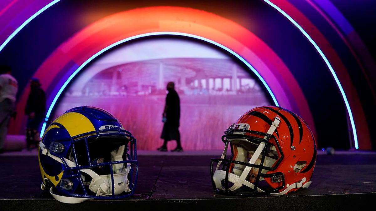 Los Angeles Rams and Cincinnati Bengals helmets rest on a stage inside the NFL Experience, an interactive fan show, Friday, Feb. 4, 2022, at the Los Angeles Convention Center in Los Angeles.