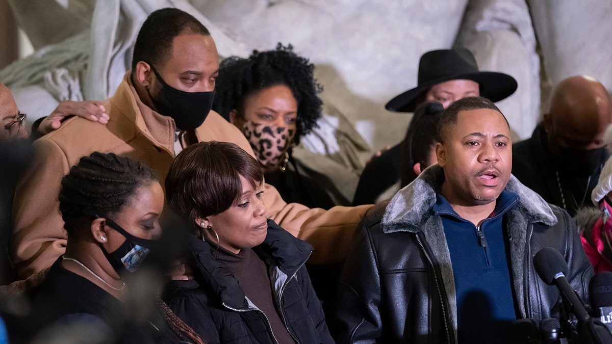 Amir Locke's father Andre Locke speaks at a news conference, with Amir's mother Karen Wells, at left, Friday, Feb. 4, 2022, in Minneapolis. (Associated Press)