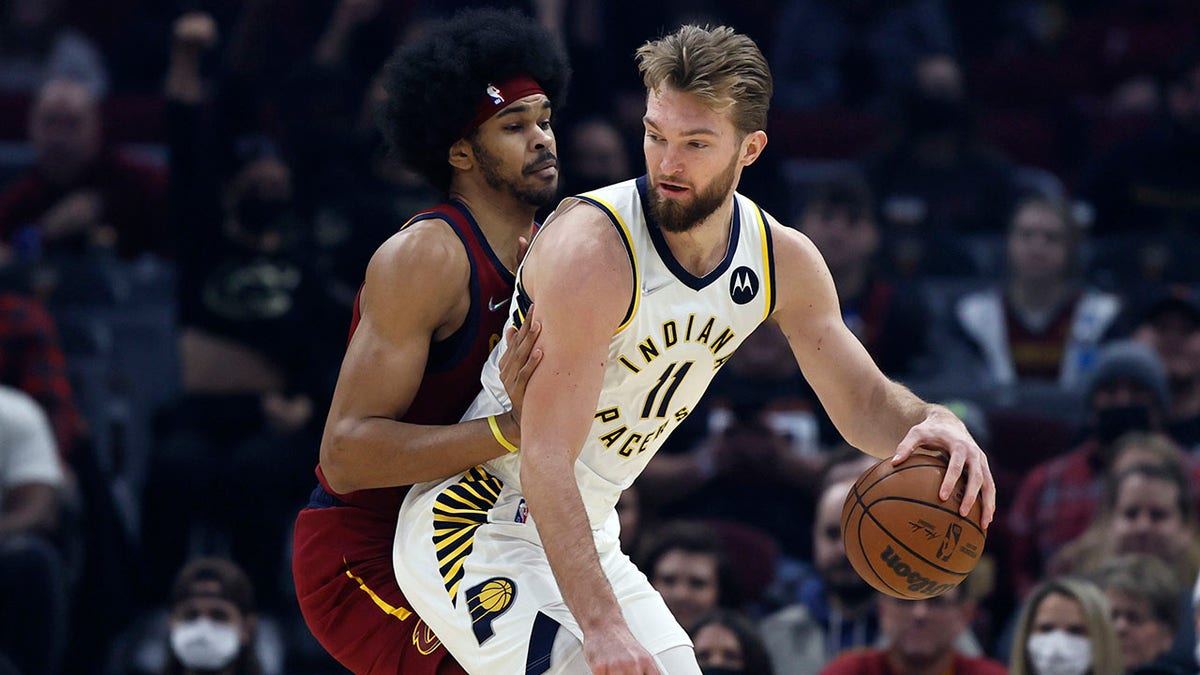 Indiana Pacers' Domantas Sabonis (11) plays against Cleveland Cavaliers' Jarrett Allen, left, during the first half of an NBA basketball game, Sunday, Feb 6, 2022, in Cleveland.