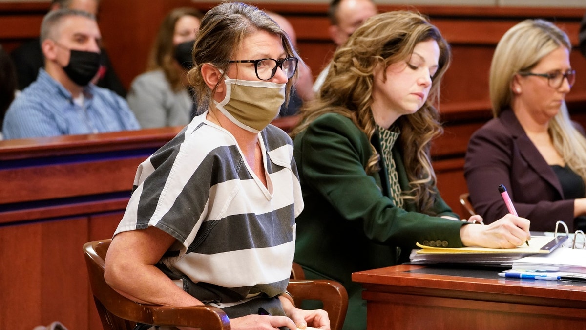 Jennifer Crumbley, mother of Ethan Crumbley, a teenager accused of killing four students in a shooting at Oxford High School, appears in court for a preliminary examination on involuntary manslaughter charges in Rochester Hills, Mich., Tuesday, Feb. 8, 2022. (AP Photo/Paul Sancya)
