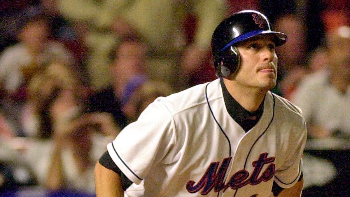 FILE - New York Mets Robin Ventura watches the path of his grand slam hit off Houston Astros pitcher Jay Powell in the seventh inning of a baseball game on May 1, 2001, at Shea Stadium in New York.  The Mets announced Tuesday, Feb. 8, 2022,  the return of Old-Timers Day for the first time since 1994.