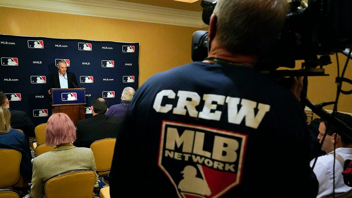 Major League Baseball commissioner Rob Manfred makes comments during a news conference at MLB baseball owners meetings, Thursday, Feb. 10, 2022, in Orlando, Fla. Manfred says spring training remains on hold because of a management lockout and his goal is to reach a labor contract that allows opening day as scheduled on March 31.