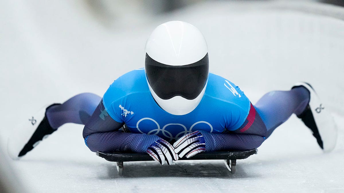 Kelly Curtis, of United States, finishes the women's skeleton run 2 at the 2022 Winter Olympics, Friday, Feb. 11, 2022, in the Yanqing district of Beijing.