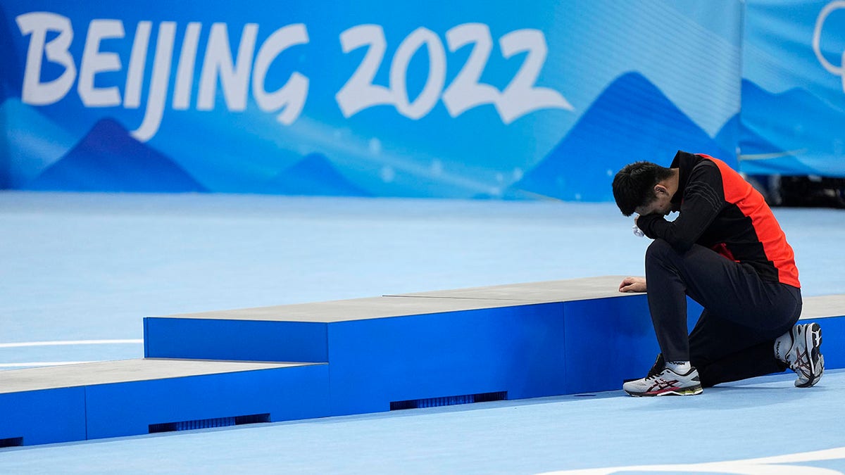 Gao Tingyu of China reacts after winning the gold medal and setting an Olympic record in the men's speedskating 500-meter race at the 2022 Winter Olympics, Saturday, Feb. 12, 2022, in Beijing.