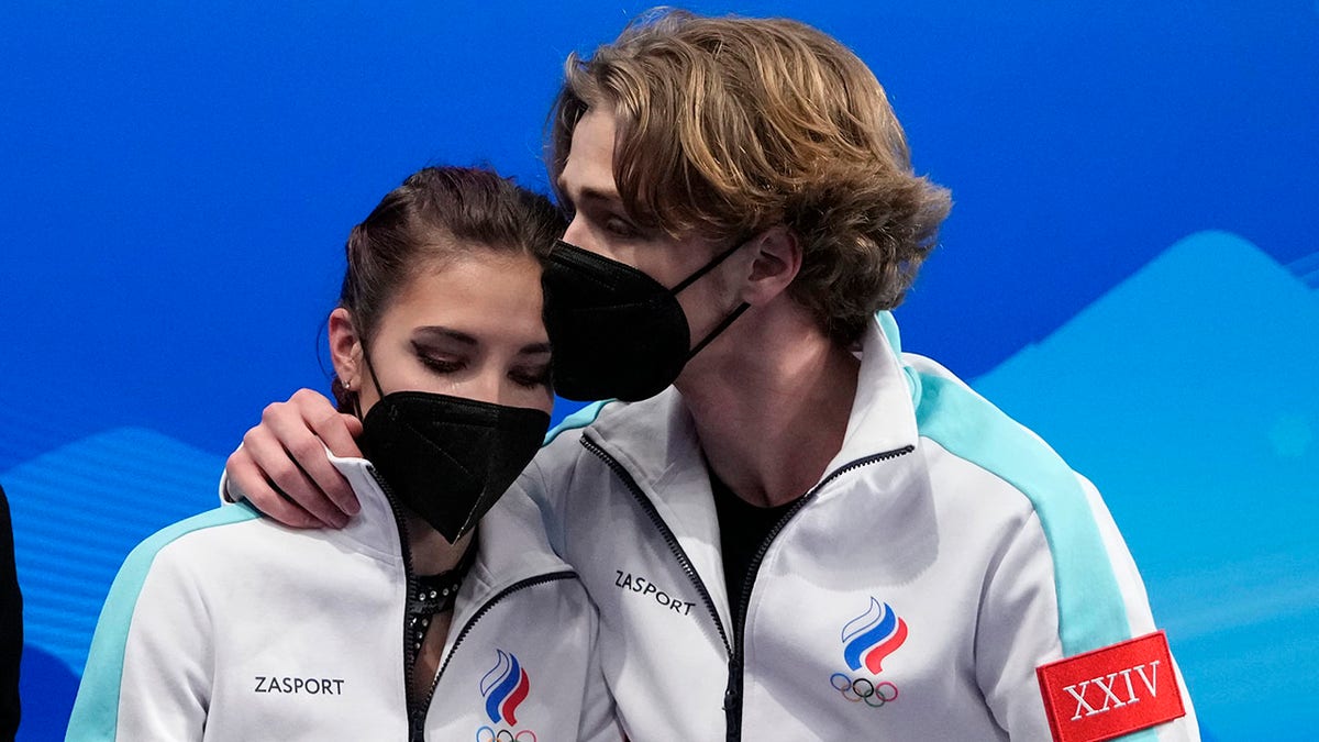 Diana Davis and Gleb Smolkin, of the Russian Olympic Committee, react after their routine in the ice dance competition during figure skating at the 2022 Winter Olympics, Saturday, Feb. 12, 2022, in Beijing.