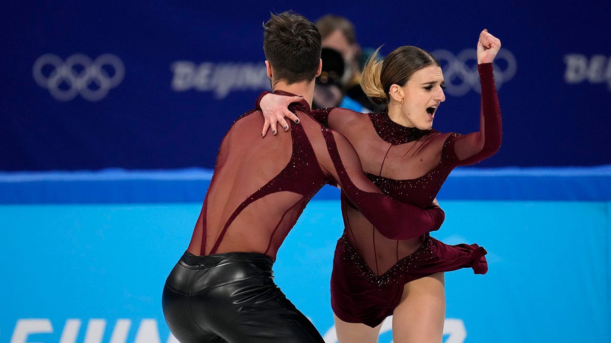 Gabriella Papadakis and Guillaume Cizeron, of France, perform their routine in the ice dance competition during figure skating at the 2022 Winter Olympics, Saturday, Feb. 12, 2022, in Beijing.