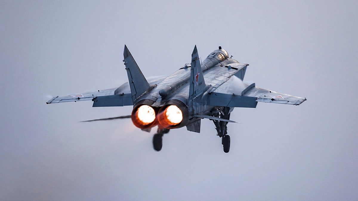In this photo provided by the Russian Defense Ministry Press Service on Monday, Feb. 14, 2022. A MiG-31 fighter of the Russian air force takes off at an air base during military drills in Tver region, Russia. (Russian Defense Ministry Press Service via AP)
