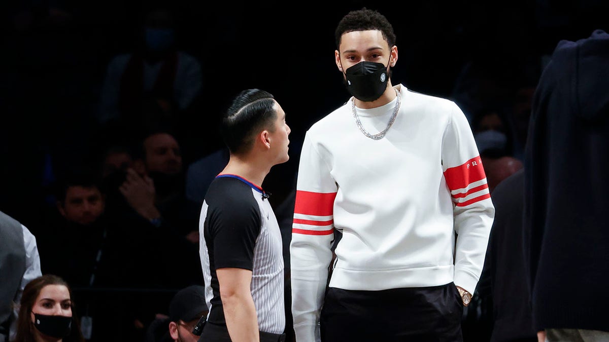 Brooklyn Nets' Ben Simmons, right, looks on during the second half of an NBA basketball game against the Sacramento Kings, Monday, Feb. 14, 2022, in New York.
