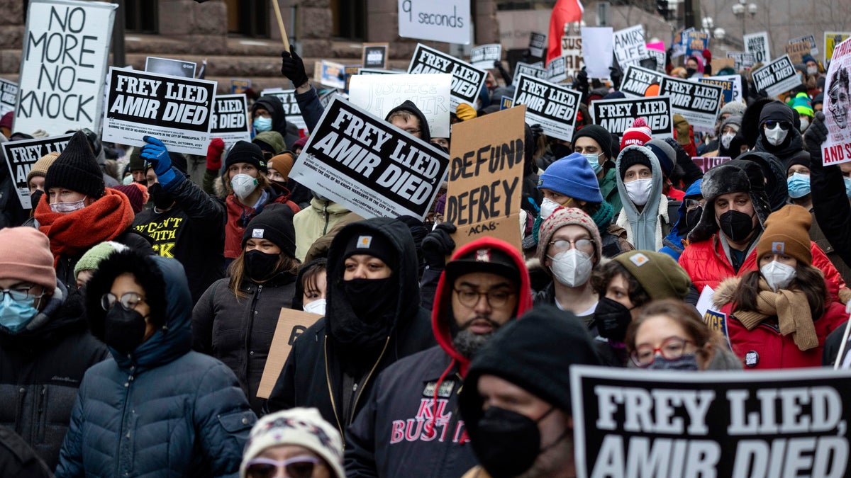People march at a rally for Amir Locke on Saturday, Feb. 5, 2022, in Minneapolis. 