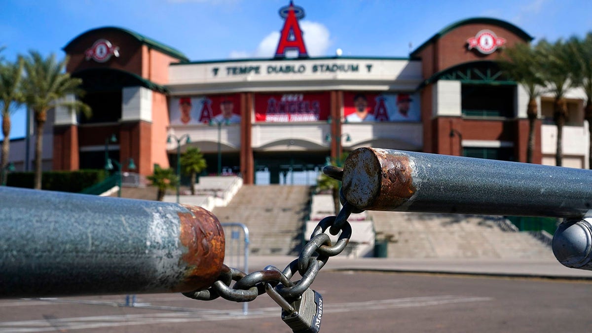 The main parking lot at the Los Angeles Angels Tempe Diablo Stadium remains closed as pitchers and catchers are not starting spring training workouts as scheduled as the Major League Baseball lockout enters its 77th day and will prevent pitchers and catchers from taking the field for the first time since October in Tempe, Ariz., Wednesday, Feb. 16, 2022. (AP Photo/Ross D. Franklin)