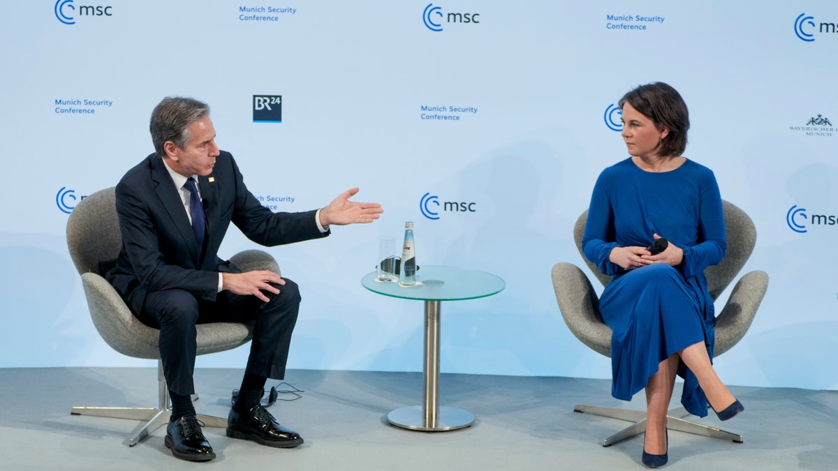 U.S. Secretary of State Antony Blinken, left, and German Foreign Minister Annalena Baerbock, right, attend a discussion during the Munich Security Conference in Munich, Germany, Friday, Feb. 18, 2022.