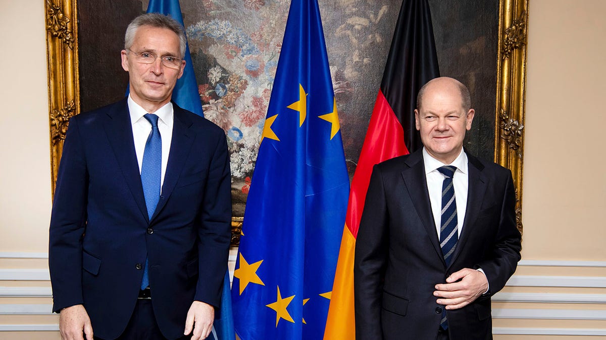 German Chancellor Olaf Scholz, right, and Jens Stoltenberg, NATO Secretary General, meet for bilateral talks at the Munich Security Conference in Munich, Germany, Saturday, Feb. 19, 2022.