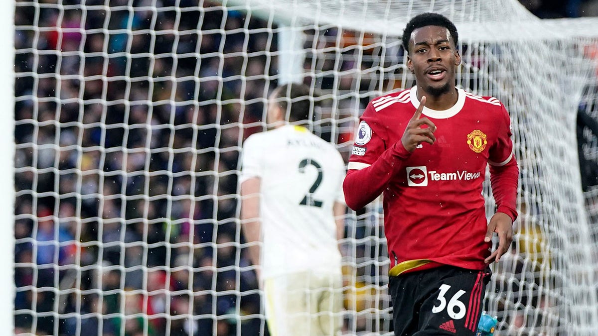 Manchester United's Anthony Elanga celebrates after scoring his side's fourth goal during the English Premier League soccer match between Leeds United and Manchester United, at Elland Road Stadium in Leeds, England, Sunday, Feb. 20, 2022.