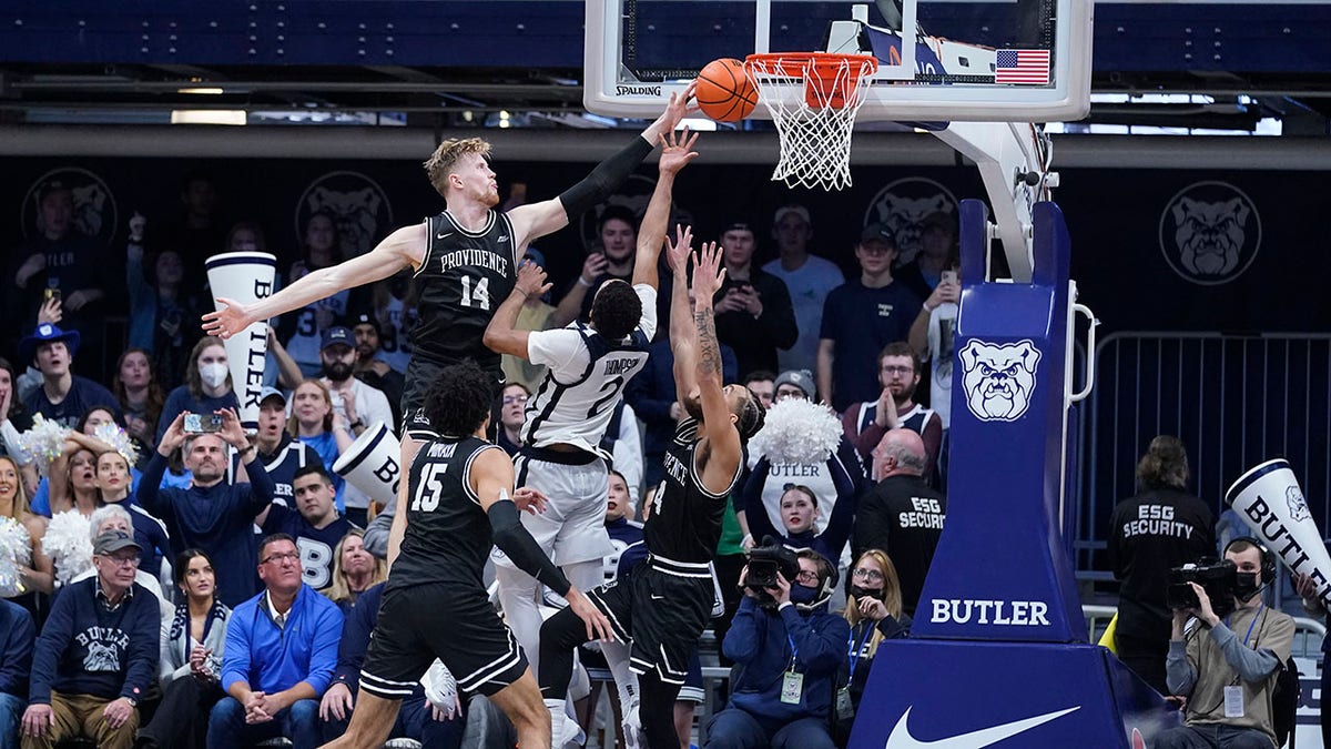 Butler's Aaron Thompson (2) has his shot blocked by Providence's Noah Horchler (14) during the second half of an NCAA college basketball game, Sunday, Feb. 20, 2022, in Indianapolis. Providence won 71-70 in overtime.