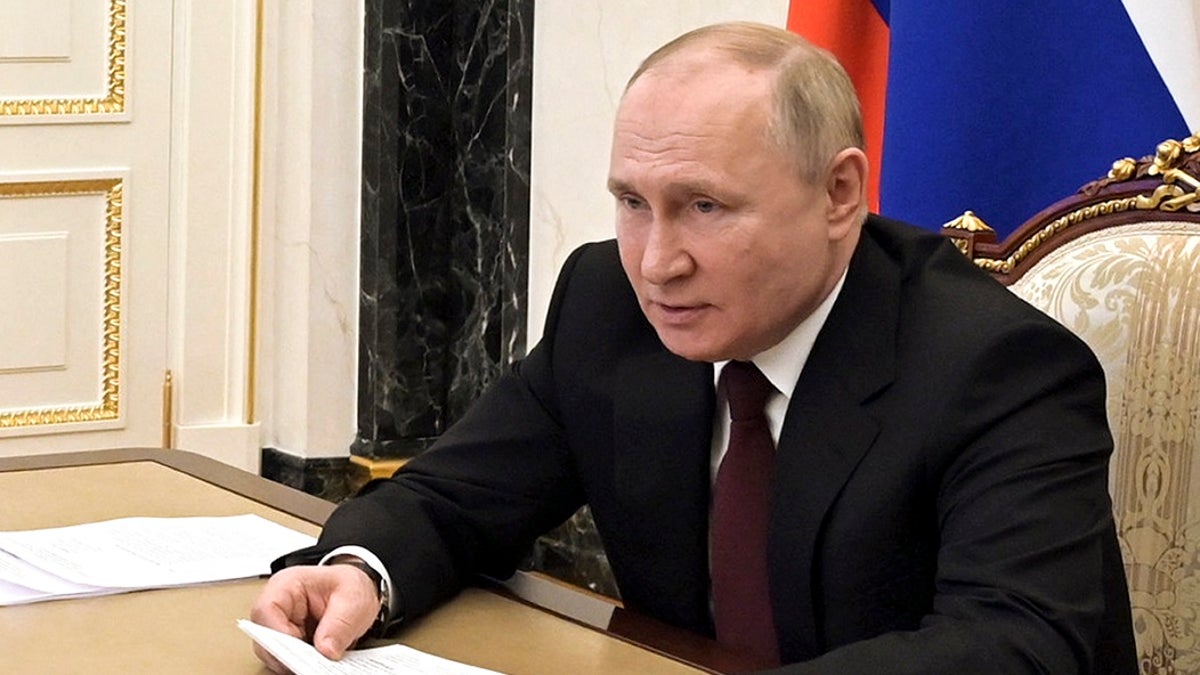 Russian President Vladimir Putin talks on video conference call with members of the Russian Paralympic Committee team on Feb. 21. The Russian leader has international condemned for the invasion of neighboring Ukraine.