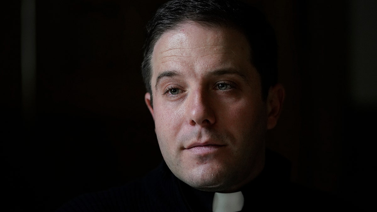 Father Matthew Hood is shown at Our Lady of the Rosary church Friday, Feb. 18, 2022, in Detroit. (AP Photo/Paul Sancya)