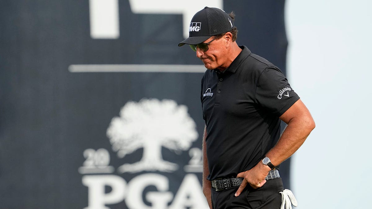 Phil Mickelson walks off the 14th green after missing a birdie putt during the third round at the PGA Championship golf tournament on the Ocean Course, Saturday, May 22, 2021, in Kiawah Island, South Carolina.