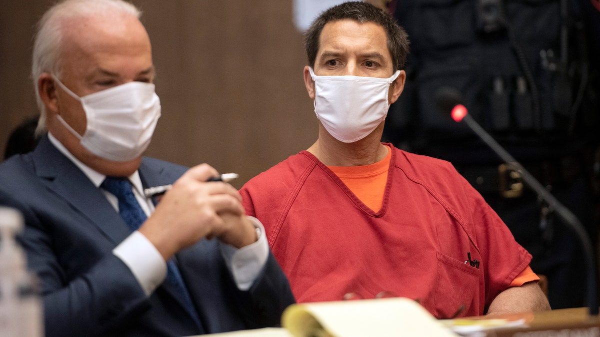 Scott Peterson listens to Stanislaus County Deputy District attorney Dave Harris speak during a hearing at the San Mateo County Superior Court in Redwood City, California, Wednesday, Dec. 8, 2021.