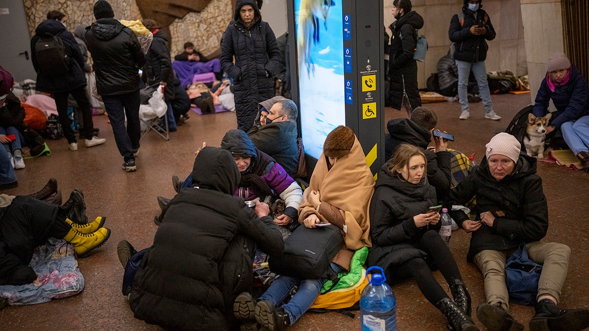 People rest in the Kyiv subway, using it as a bomb shelter in Kyiv, Ukraine, Thursday, Feb. 24, 2022. Russia has launched a full-scale invasion of Ukraine, unleashing airstrikes on cities and military bases and sending troops and tanks from multiple directions in a move that could rewrite the world's geopolitical landscape. (AP Photo/Emilio Morenatti)