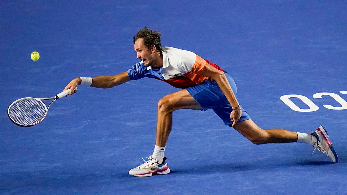 Russia's Daniil Medvedev hits a return to Spain's Rafael Nadal during their semifinal match at the Mexican Open tennis tournament in Acapulco, Mexico, Friday, Feb. 25, 2022.