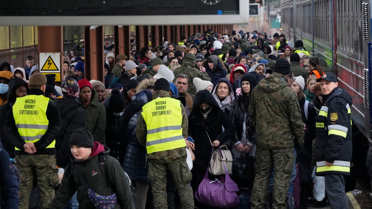 Refugees from Ukraine arrive to the railway station in Przemysl, Poland, Sunday, Feb. 27, 2022. (AP Photo/Czarek Sokolowski)