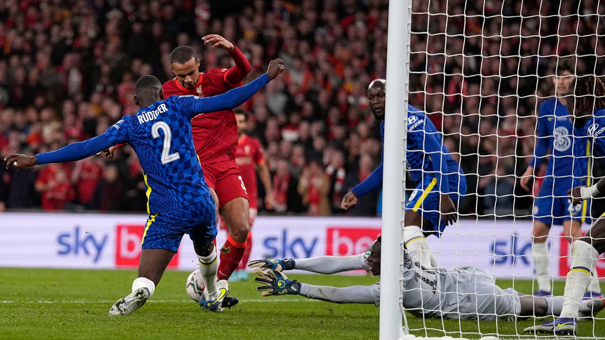 Chelsea's goalkeeper Edouard Mendy dives for a save during the English League Cup final soccer match between Chelsea and Liverpool at Wembley stadium in London, Sunday, Feb. 27, 2022.
