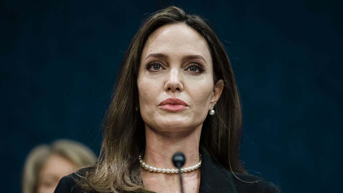 Angelina Jolie at a podium