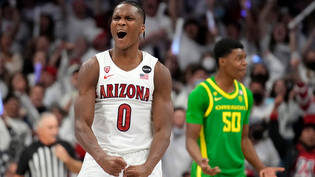Arizona guard Bennedict Mathurin (0) reacts after scoring against Oregon during the first half of an NCAA college basketball game, Saturday, Feb. 19, 2022, in Tucson, Ariz. 