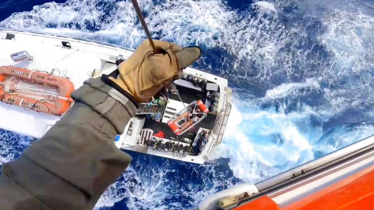 This image provided by U.S. Coast Guard a Coast Guard Air Station Miami MH-65 Dolphin helicopter crew rescues a man after he was bitten by a shark while fishing aboard a vessel near Bimini, Bahamas, on Monday, Feb. 21, 2022. The man was taken to Jackson Memorial Hospital in Miami, where he was in stable condition.