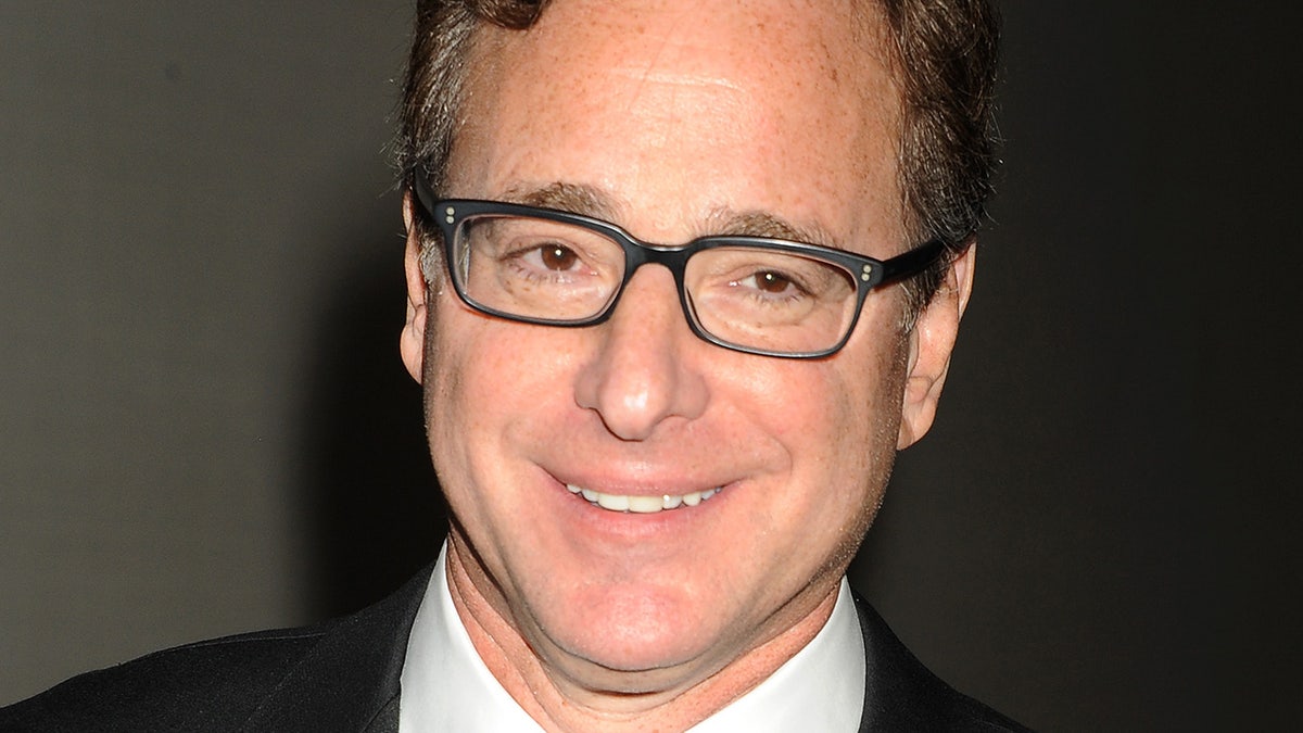 Actor Bob Saget poses during the 2015 Writers Guild Awards L.A. Ceremony at the Hyatt Regency Century Plaza on Feb. 14, 2015, in Century City, California.