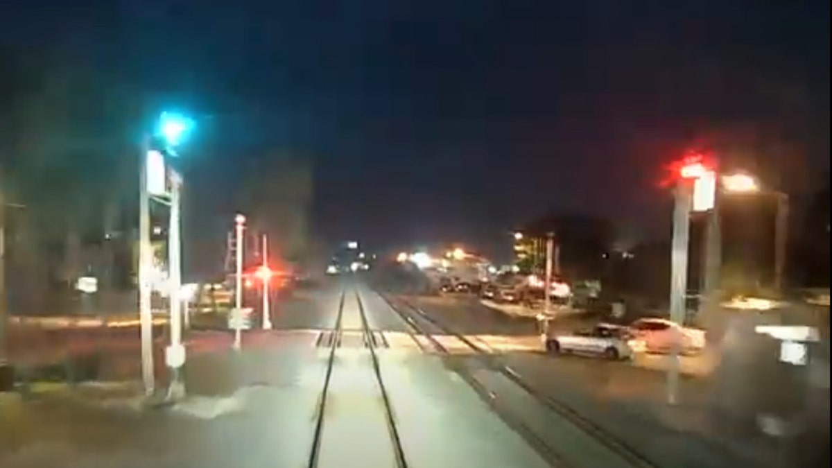A Florida man is in stable condition after harrowing video shows his car speed into the path of an oncoming train in Lake Worth Wednesday morning.