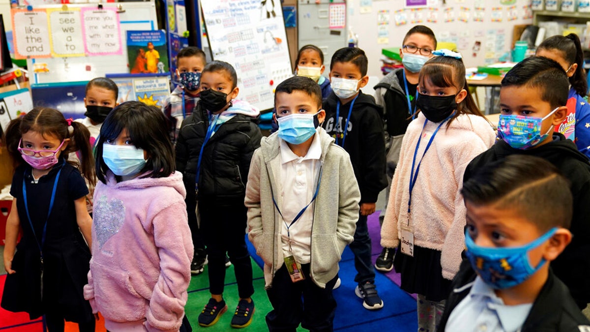 FILE: Kindergarteners wear masks while listening to their teacher amid the COVID-19 pandemic at Washington Elementary School on Jan. 12, 2022, in Lynwood, Calif.