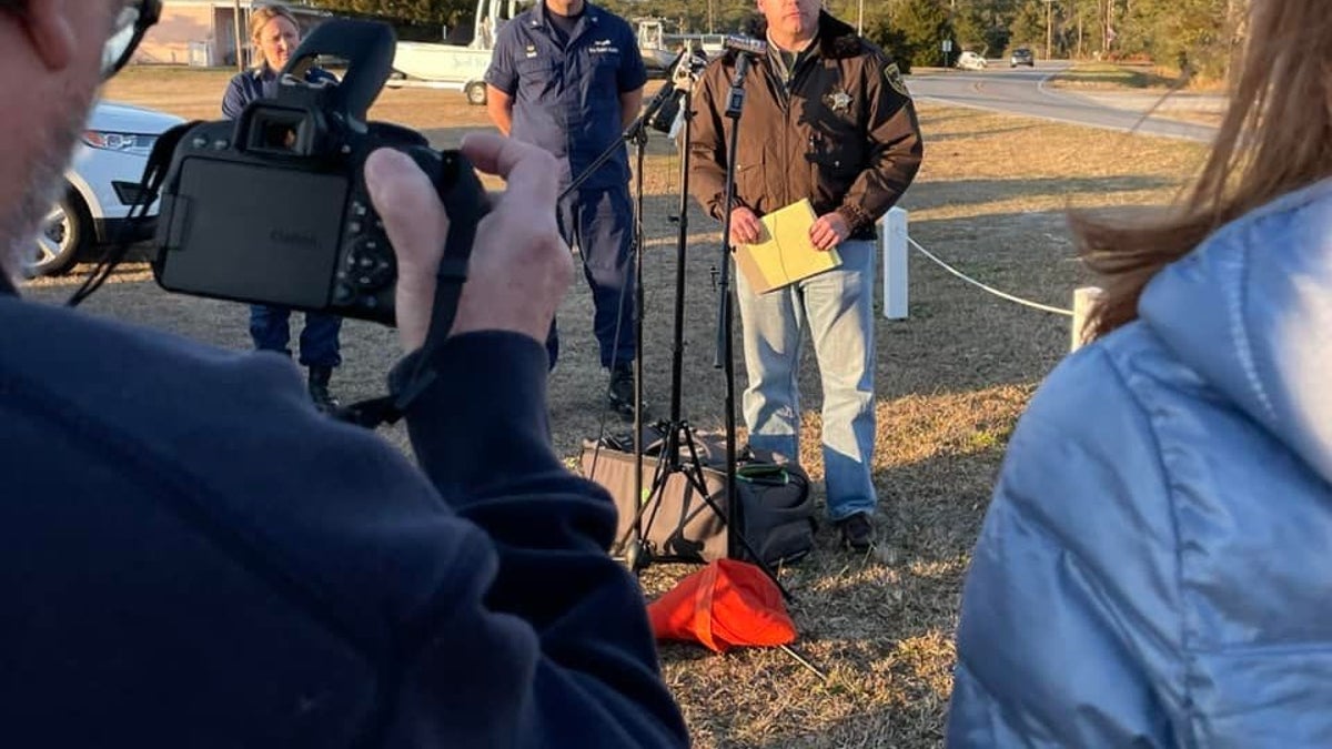 Carteret County Sheriff Asa Buck gives an update Monday on a plane crash in North Carolina. He said one body had been recovered and it appeared none of the eight people abroad the aircraft have survived. 