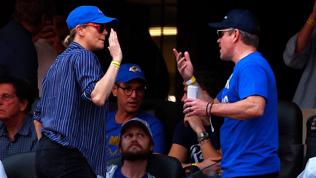 Charlize Theron and Matt Damon hang out at Super Bowl LVI.