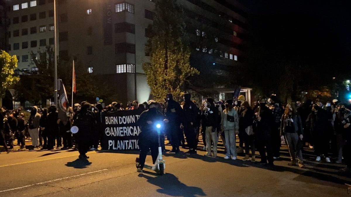 Anti-fascist and black bloc demonstrators march in Washington, D.C. on November 4, 2020