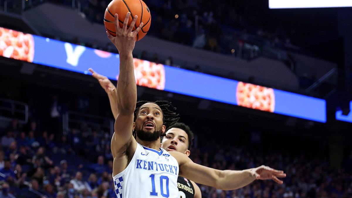 Kentucky's Davion Mintz (10) shoots while defended by Vanderbilt's Scotty Pippen Jr. during the first half of an NCAA college basketball game in Lexington, Ky., Wednesday, Feb. 2, 2022.