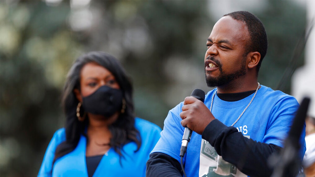 FILE: Greg Bailey, front, speaks at a news conference about the death of his son, De'Von, during a police stop in Aug. 2019 in Colorado Springs, Colo.