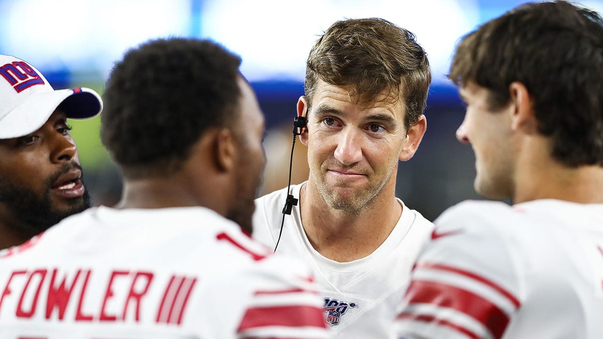 Eli Manning of the New York Giants talks to his teammates during a preseason game against the New England Patriots at Gillette Stadium on Aug. 29, 2019, in Foxborough, Massachusetts.