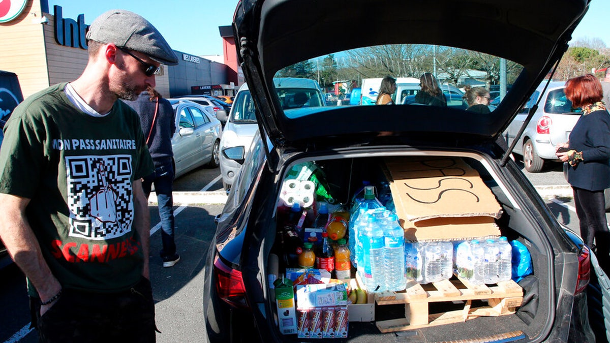 Protesters prepare to leave for Paris , in Bayonne, southwestern France, Wednesday, Feb.9, 2022.