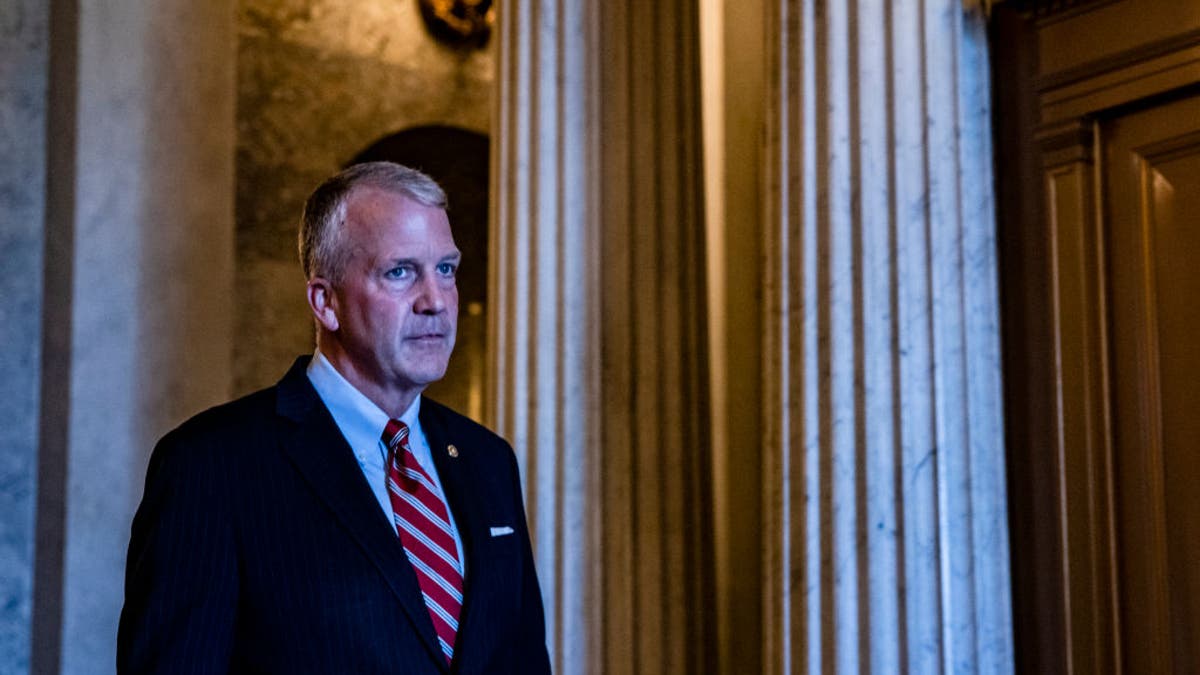 Sen. Dan Sullivan, R-Alaska, leaves the floor of the Senate on August 8, 2021, in Washington, D.C.