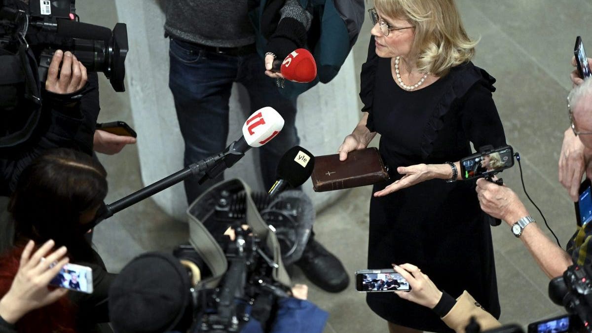 MP of the Finland's Christian Democrats Paivi Rasanen holds a bible as she speaks to media ahead of a court session at the Helsinki District Court in Helsinki, Finland on January 24, 2022. - The trial against former interior minister and Christian Democrats leader Paivi Rasanen over four charges of incitement against a minority group has started on January 24, 2022. - Finland OUT (Photo by Antti Aimo-Koivisto / Lehtikuva / AFP) / Finland OUT (Photo by ANTTI AIMO-KOIVISTO/Lehtikuva/AFP via Getty Images)
