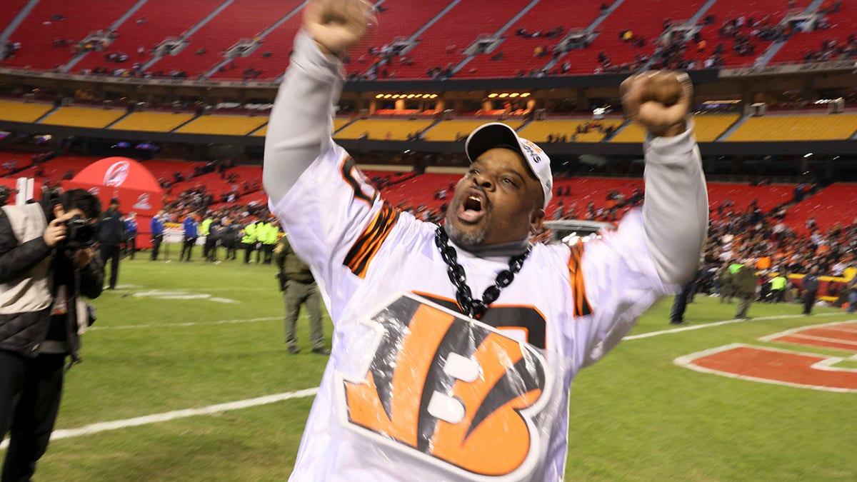 Former Cincinnati Bengals Ickey Woods celebrates on the field after the Bengals beat the Kansas City Chiefs at Arrowhead Stadium in Kansas City, Missouri.