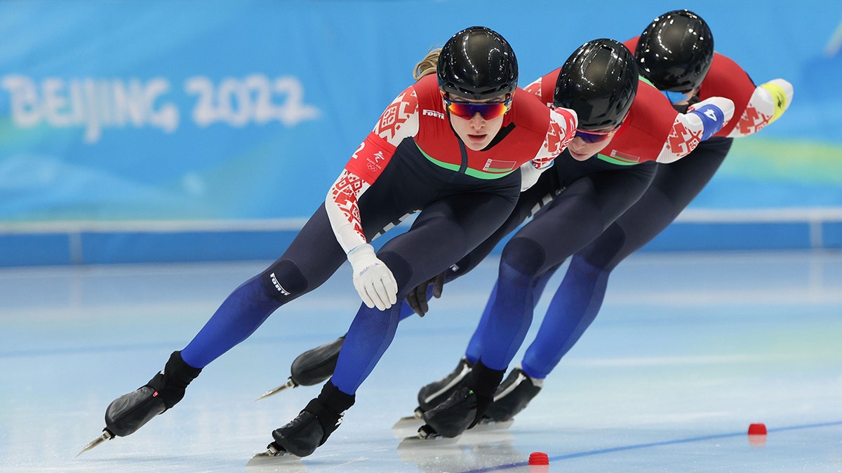 Athletes of Belarus compete during the speed skating women's team pursuit quarterfinal at the National Speed Skating Oval in Beijing, capital of China, Feb. 12, 2022. 