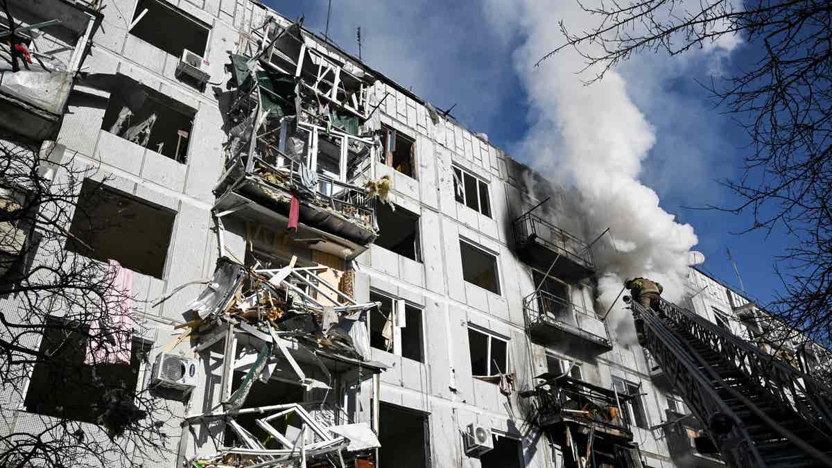 Firefighters working on building in Chuguiv, Ukraine after attacks