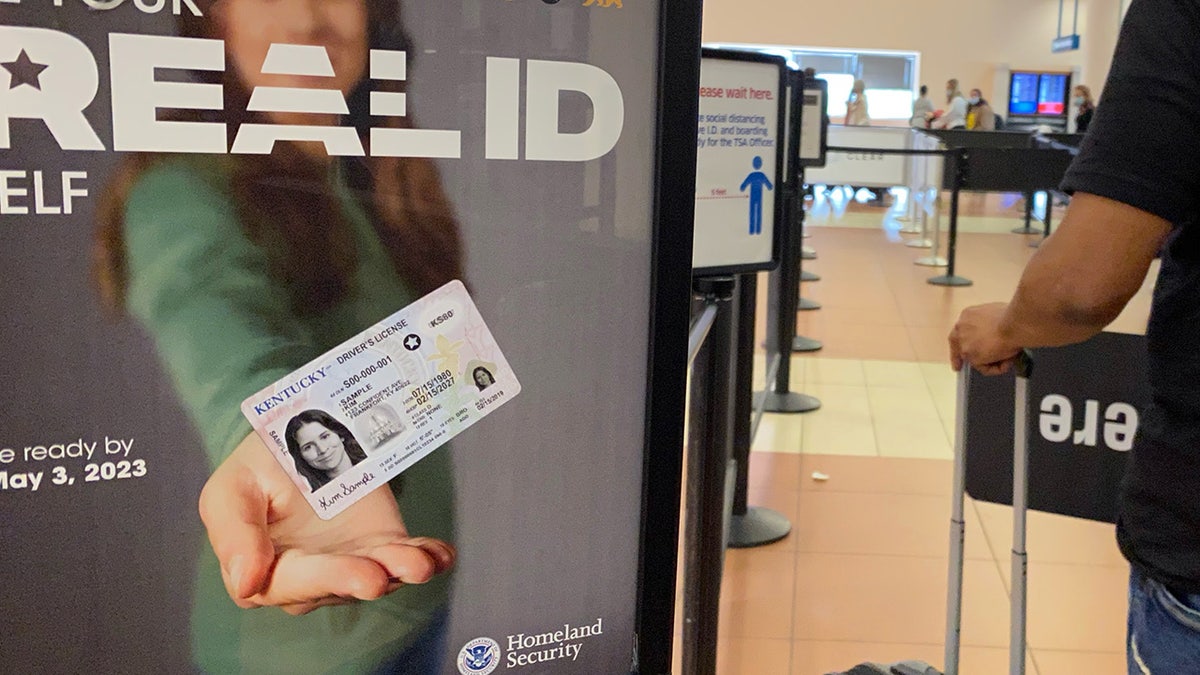 Homeland Security sign for REAL ID at entrance to passenger TSA security area, West Palm Beach, Florida.