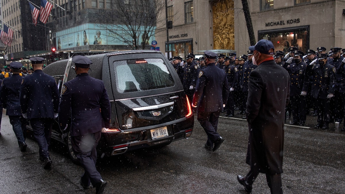 New York City mayor Eric Adams floors the Hearst carrying the body of police officer Jason Rivera after his funeral on January 28, 2022 along Fifth Avenue outside of St Patricks Cathedral in New York City, New York. Rivera was shot to death in Harlem while responding to a domestic dispute. (Photo by Andrew Lichtenstein/Corbis via Getty Images)