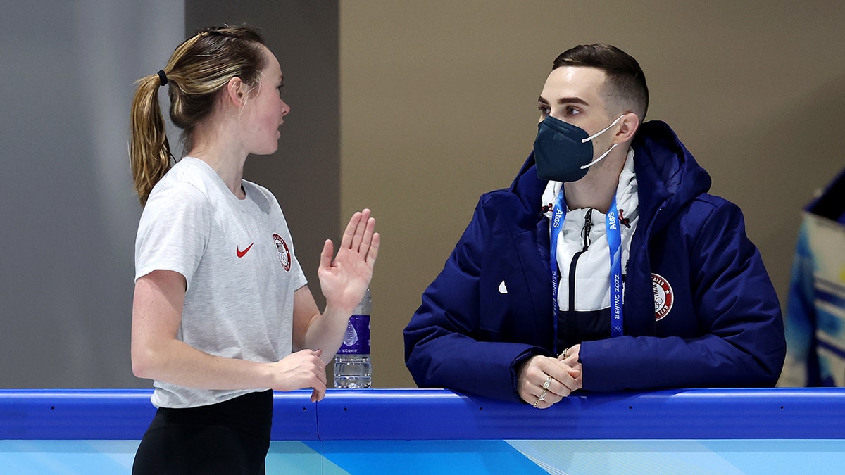 Mariah Bell of Team United States talks with coach and former Olympic figure skater Adam Rippon during a practice session ahead of the Beijing 2022 Winter Olympic Games at Capital Indoor Stadium on Feb. 1, 2022, in Beijing, China. 