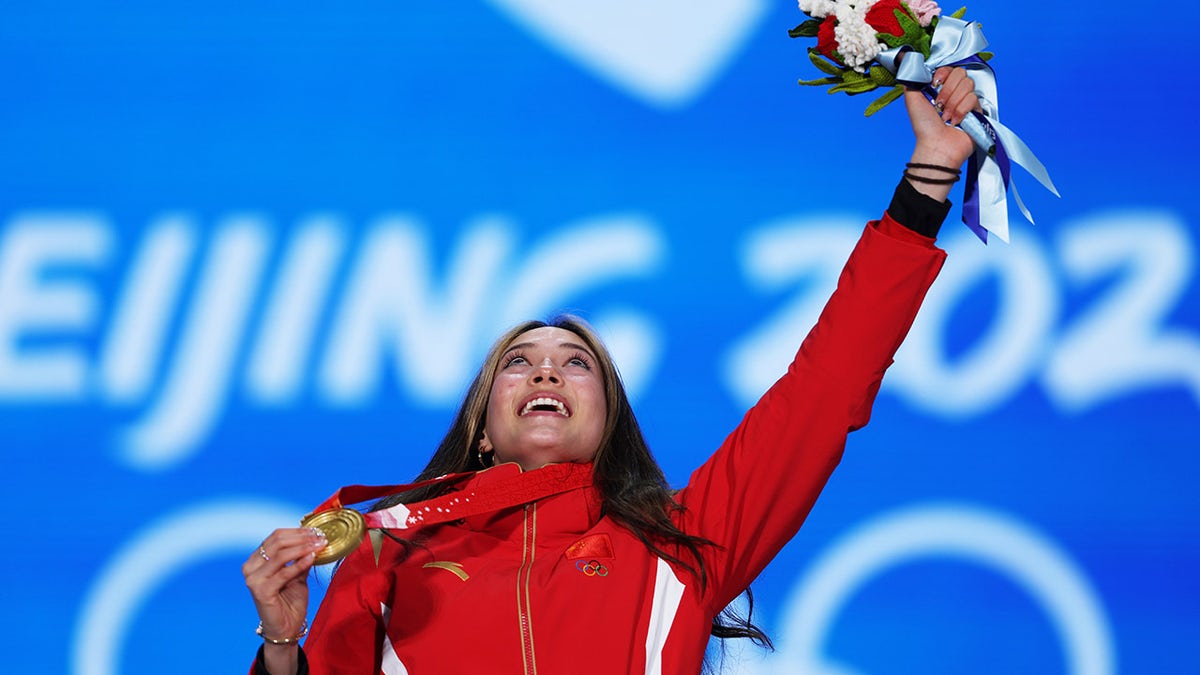 Gold medalist Eileen Gu of Team China celebrates with her medal during the Women's Freestyle Skiing Freeski Big Air medal ceremony on Day 4 of the Beijing 2022 Winter Olympic Games at Beijing Medal Plaza on Feb. 8, 2022, in Beijing, China.