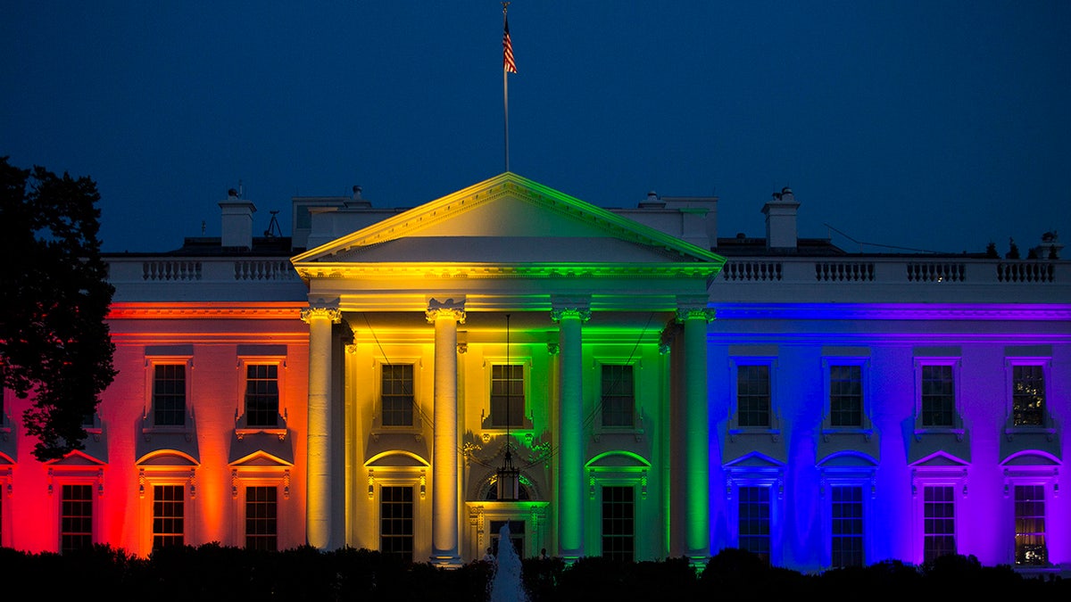 The White House stands illuminated in rainbow-colored light at dusk in Washington, D.C., U.S., on Friday, June 26, 2015.